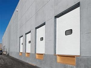 As portas secionais isoladas térmicas do revestimento do pó Sus304 comprimem resistente para o armazém